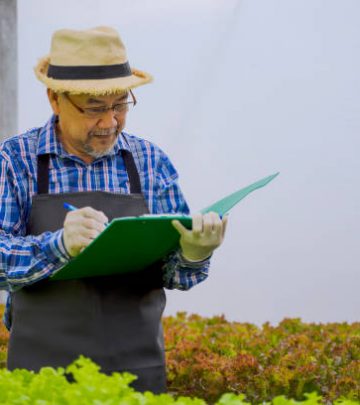 Farmer doing a checklist of his garden